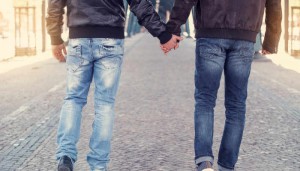 two men holding hands