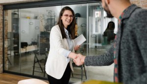 Openly greeting a job recruiter with a firm handshake